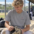 Teen baseball player wearing a Granite Built for the Game Glove adult T-shirt with the small TB 03 Glove System left-chest graphic.
