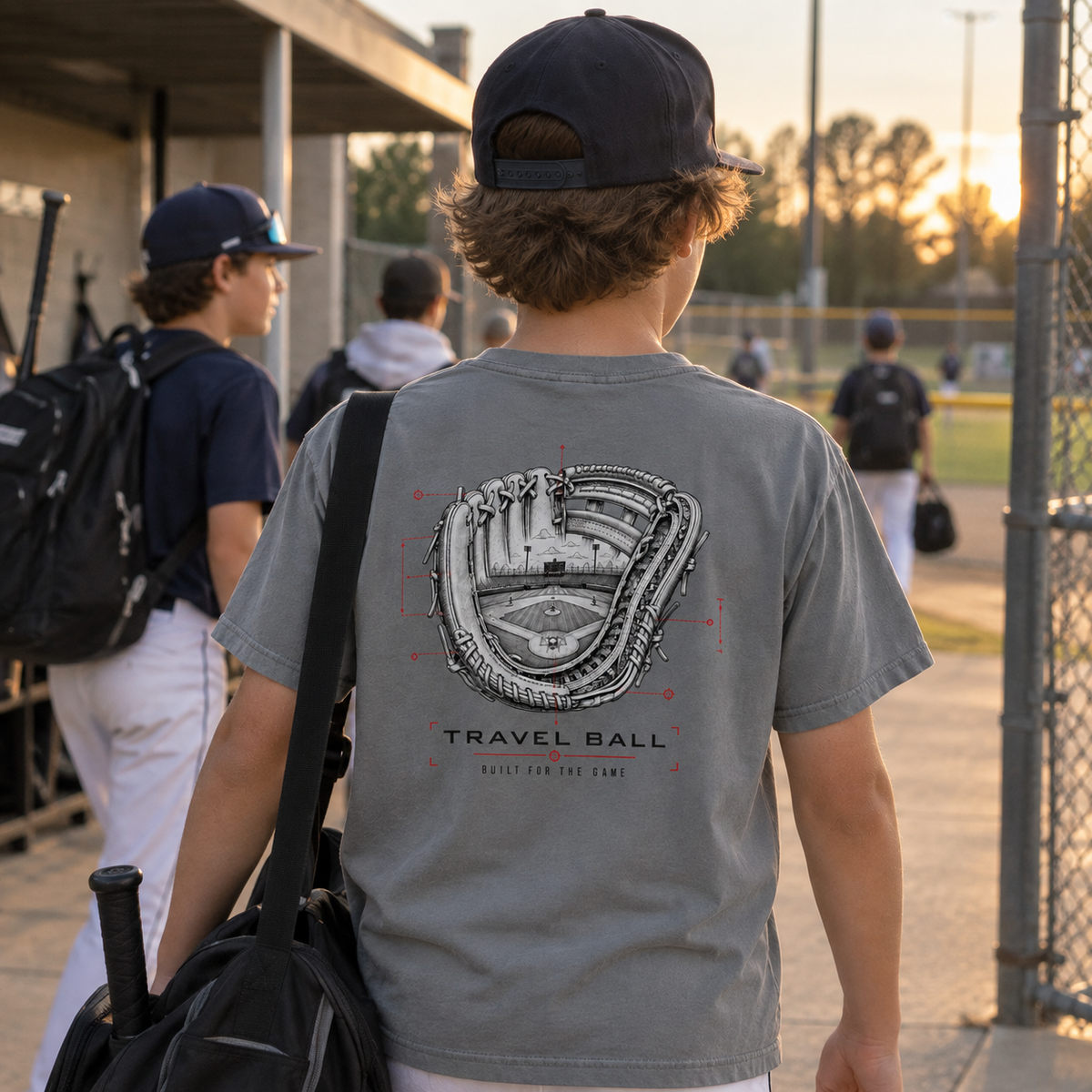 Youth baseball player wearing a Granite Built for the Game Glove T-shirt with the large technical glove and baseball field back graphic.