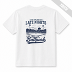 White youth baseball T-shirt with large “Late Nights at the Ballpark” back graphic.