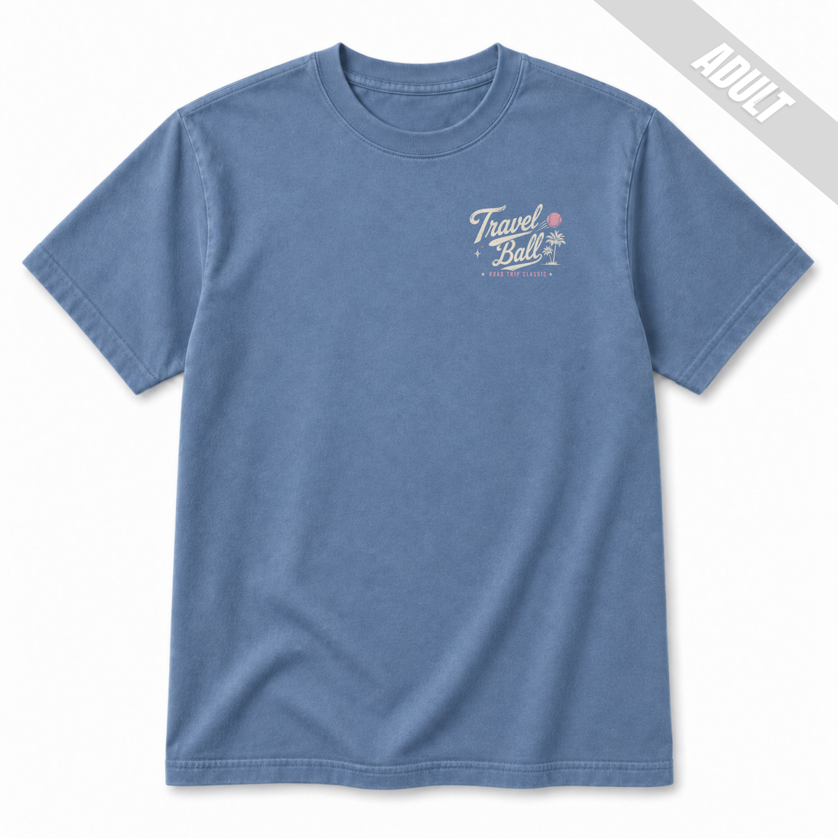 Front view of an adult Washed Denim travel ball T-shirt featuring a small left chest Travel Ball Road Trip Classic graphic in off-white and pink.