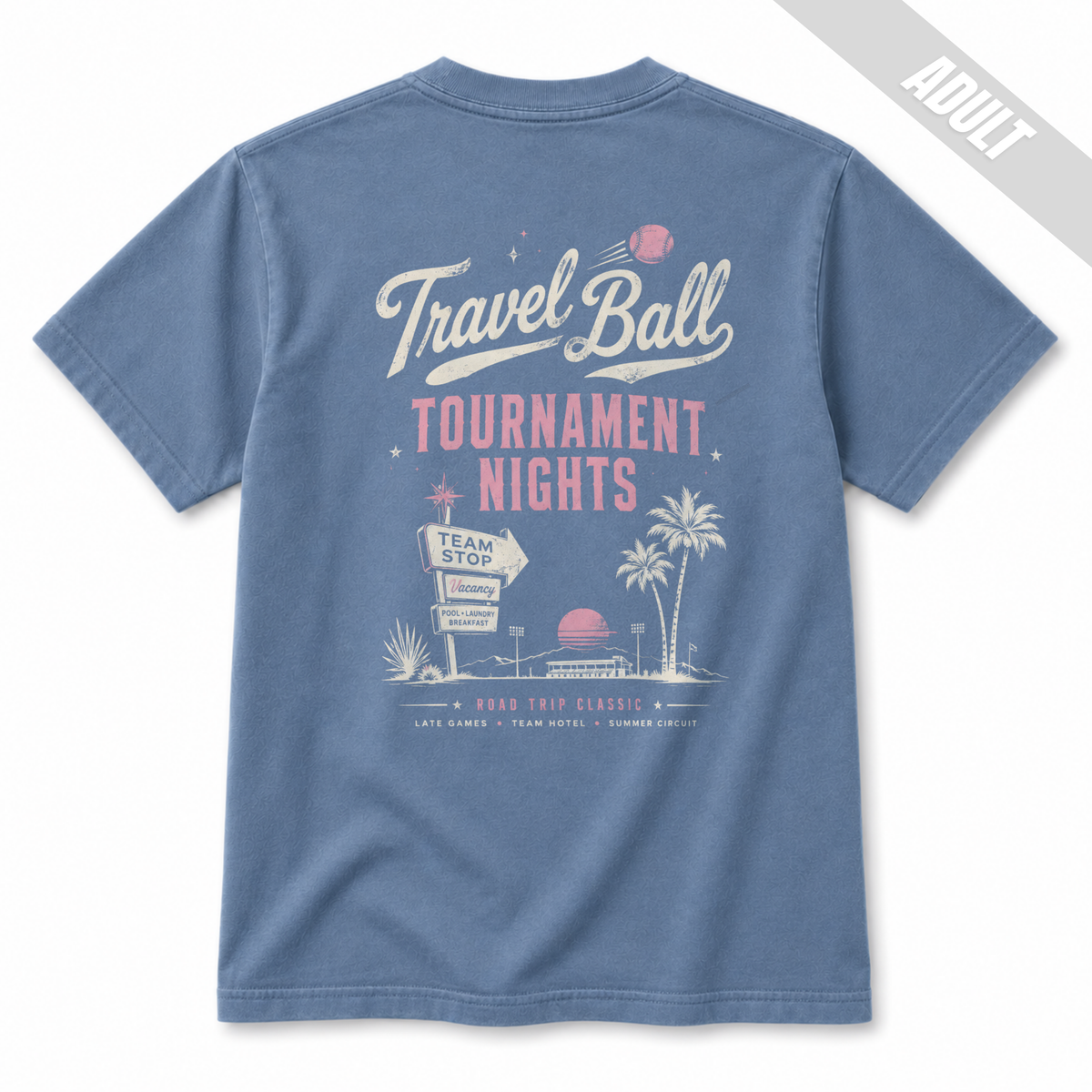 Back view of an adult Washed Denim baseball T-shirt with a large vintage Travel Ball Tournament Nights graphic in off-white and pink with palm trees, sunset, and retro travel ball design details.