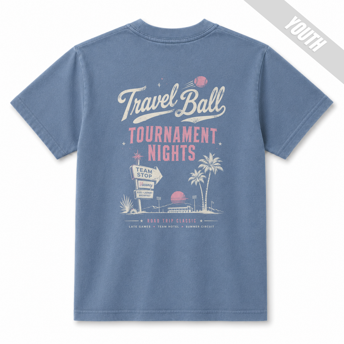 Back view of a Washed Denim youth baseball T-shirt featuring a large vintage Travel Ball Tournament Nights design with palm trees, a team stop sign, and retro tournament graphics.